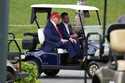 President Donald Trump, driven by his son Eric Trump, arrives at Trump National Doral during the LI…